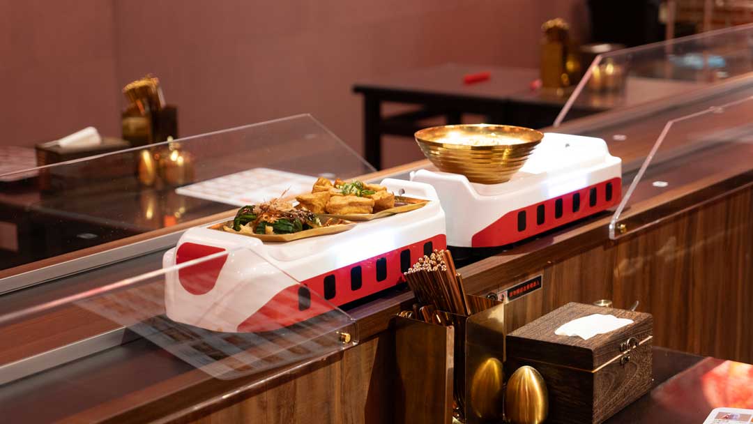 Hong Chiang delivery robots operating 24/7, saving 1200 minutes of labor daily